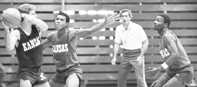 Kansas University basketball player Darnell Valentine defends a teammate in practice in this 1980 file photo. The 1980 Jayhawks registered the program's 1,200th victory, defeating Pepperdine in a runaway December victory.