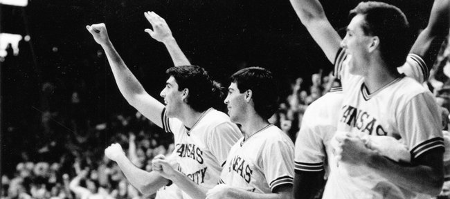 Members of the 1989 Kansas University basketball team cheers from the bench in this file photo. The Jayhawks picked up the program's 1,400th victory in February 1989, defeating Colorado to end an eight game losing streak.