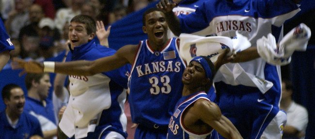 The KU bench erupts after a Kirk Hinrich three pointer in the first half of the team's NCAA Tournament victory against Arizona. The Jayhawks defeated Arizona to secure the program's 1,800th victory.