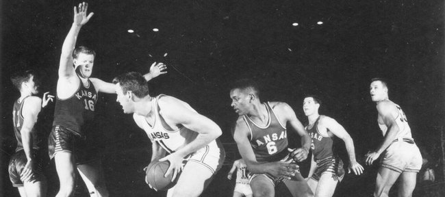 The 1951-1952 Kansas University basketball team practices in this file photo. The team, which featured Bill Leinhard (#11), Clyde Lovellette (#16), LaVannes Squires (#6) and Charlie Hoag (#5), notched the program's 700th victory by defeating Missouri in a game played in Kansas City, Mo.