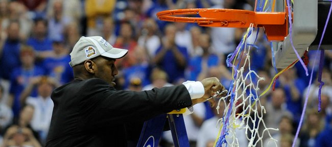 Kansas assistant coach Danny Manning clips his share of the net following the Jayhawks National Championship victory over Memphis on April 7 at the Alamodome in San Antonio. Manning will be inducted into the National College Basketball Hall of Fame tonight at the Sprint Center in Kansas City, Mo.
