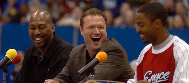 From left, Danny Manning, Bill Self and Aaron Miles crack jokes during Late Night at Allen Fieldhouse in this October 13, 2006, file photo.